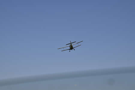 Aircraft agricultural aviation AN-2. The spraying of fertilizers and pesticides on the field with...