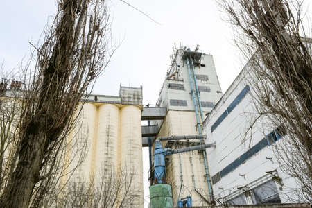 Building for storing and drying grain. Soviet-built elevator.の写真素材