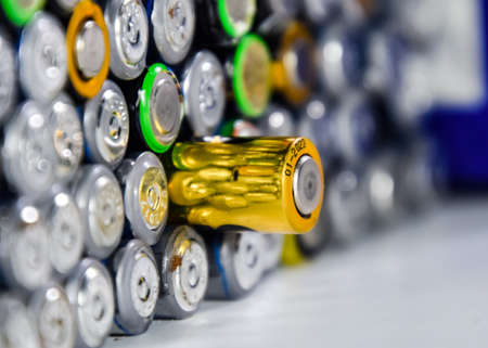 Salt and alkaline batteries, a source of energy for portable technology. AAA and AA batteriesの写真素材