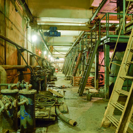 Basement of a water pumping station. Abandoned post-apocalyptic view of the basement pumping rooms.の写真素材
