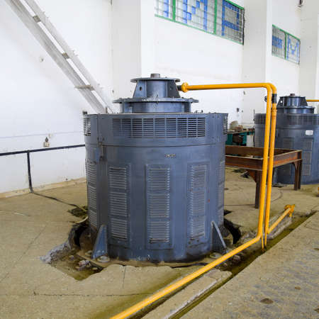 Engines of water pumps at a water pumping station. Pumping irrigation system of rice fields. Room...