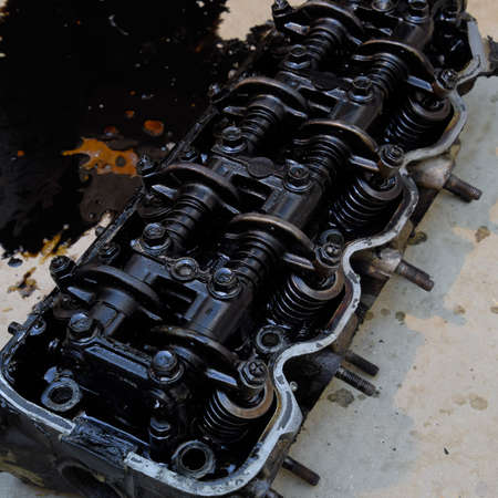 The head of the block of cylinders. The head of the block of cylinders removed from the engine for...