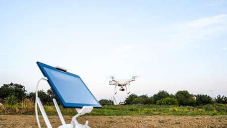 Russia, Poltavskaya village - 28 August 2016: Quadrocopters 4 Phantom and a remote control for it. Quadrocopters against the blue sky. Umravlenie quadrocopters 4 Phantom.のeditorial素材