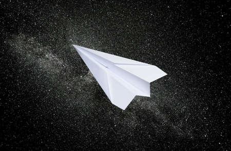White paper airplane on a starry background. The symbol of freedom and privacy on the Internet.の写真素材