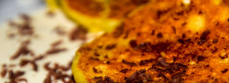 Cheesecakes with sour cream and chocolate chips on a plate.の写真素材