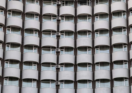 Background texture of balconies and windows of the hotel. The wall of the hotel with balconies and windows.の写真素材