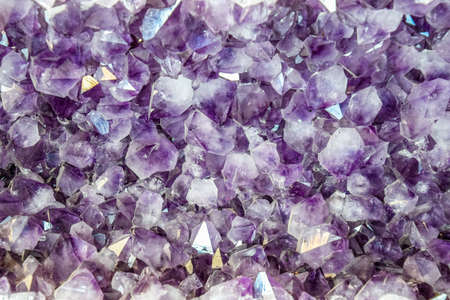Amethyst druse, amethyst crystals close up view, precious stone.
