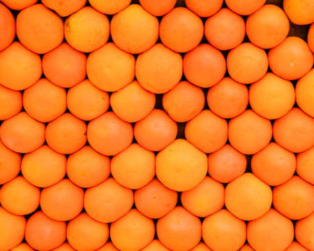 Background texture of orange fruit. Oranges on the counter.の写真素材