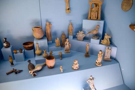 Antalya, Turkey - May 20, 2019: Clay and metal dishes and clay figurines and figurines in the museum of antiquity of Antalya.のeditorial素材