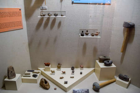 Antalya, Turkey - May 20, 2019: Ancient stone axes and pottery. Exhibits of the Antalya Museum of...