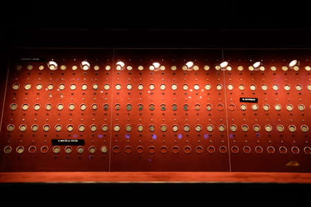 Antalya, Turkey - May 20, 2019: Coins at the Antalya Antiquities Museum. Old coins on the rack with light.のeditorial素材