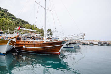 Demre, Turkey - May 22, 2019: Yachts on the sea coast. Pleasure boats at the pier.のeditorial素材