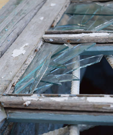 Windows with the broken glasses. The old thrown gas station.の写真素材