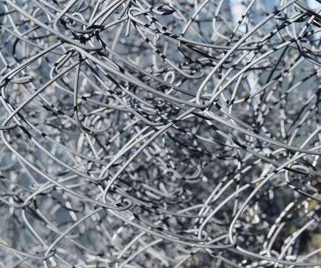 Background of folded mesh netting. Grey mesh netting.