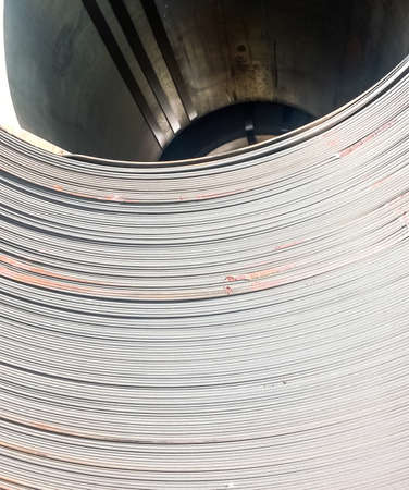 Steel sheets rolled up into rolls. Export Steel. Packing of steel for transportation.の写真素材