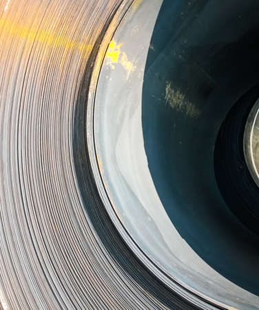 Steel sheets rolled up into rolls. Export Steel. Packing of steel for transportation.