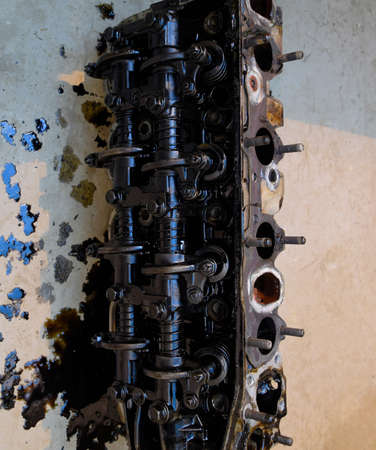 The head of the block of cylinders. The head of the block of cylinders removed from the engine for...