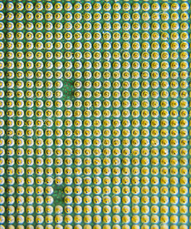 Computer processor, contact feet. Electronic board with electrical components. Electronics of...