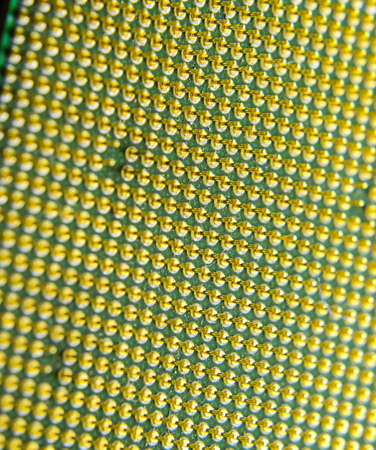 Computer processor, contact feet. Electronic board with electrical components. Electronics of computer equipment.の写真素材