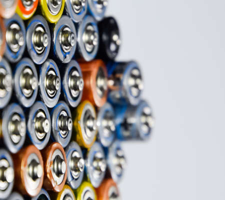 Salt and alkaline batteries, a source of energy for portable technology. AAA and AA batteriesの写真素材