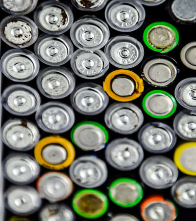 Salt and alkaline batteries, a source of energy for portable technology. AAA and AA batteriesの写真素材