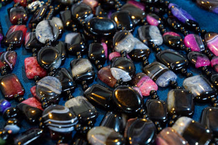Indian beads and jewelry on the counter in the store.の写真素材