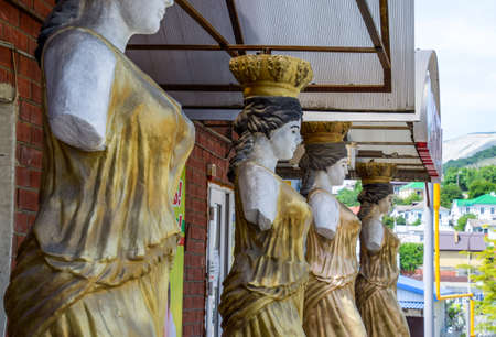 Novorossiysk, Russia - May 20, 2018: Statues of women without hands in the form of an aphrodite as supports for a canopy.のeditorial素材