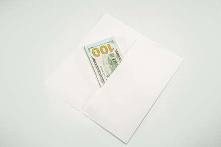 Dollars in a conwind on a white background, a lot of money in an envelope.の写真素材