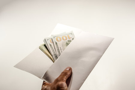 Dollars in a conwind on a white background, a lot of money in an envelope.