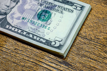 Dollars on a wooden table. Money on the table. american dollars.