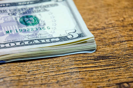 Dollars on a wooden table. Money on the table. american dollars.