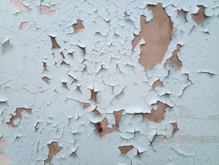 Background texture wall with peeling paint. Peeling old paint off the wall.の写真素材