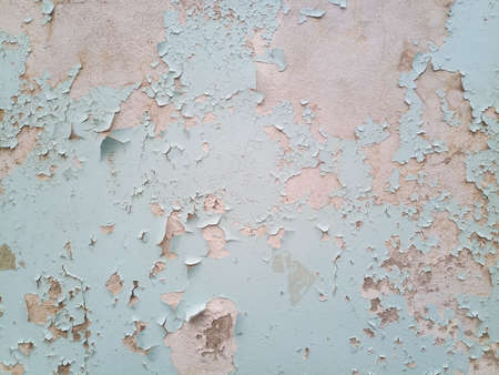 Background texture wall with peeling paint. Peeling old paint off the wall.の写真素材