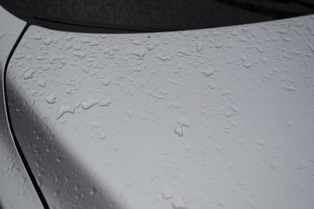 Water droplets on the surface of a car after a rain.の写真素材