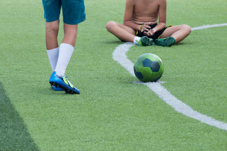 Children play football in the lawn.の写真素材