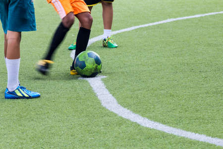 Children play football in the lawn.の写真素材