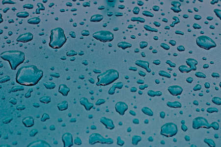 Water drops on green car