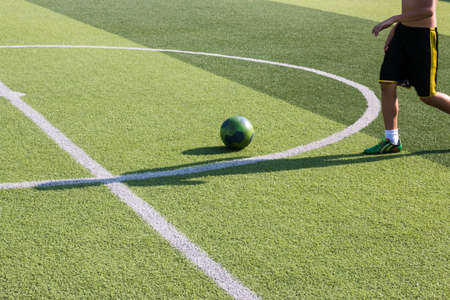 Children play football in the lawn.の写真素材