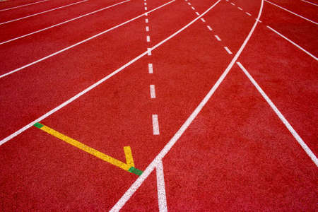Red running track Synthetic rubber on the athletic stadium.