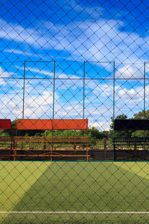 Viewed from behind the cage of football field in the Thailand countryの写真素材