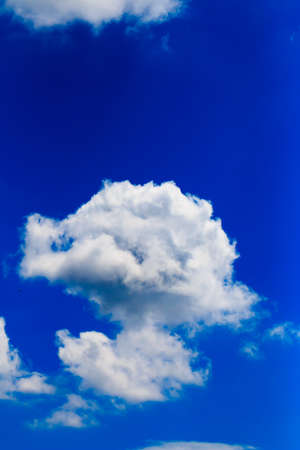 Bright blue sky with white cloudsの写真素材