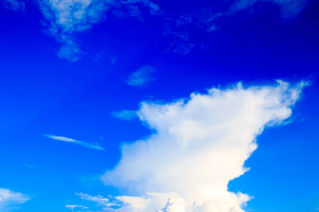Bright blue sky with white clouds