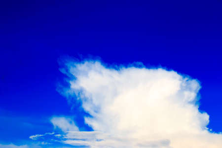 Bright blue sky with white cloudsの写真素材