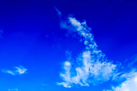 Bright blue sky with white clouds