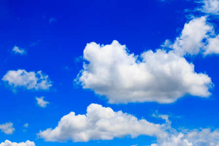Bright blue sky with white cloudsの写真素材