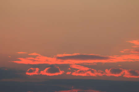 Oragne Clouds reflect sunlight In evening