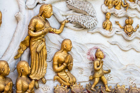 Thai style cement carving art on temple wall  in Wat Chai Mongkon - Buddhist Temple , Chiang Mai Thailandの写真素材