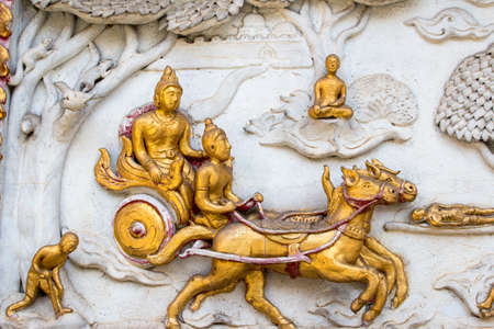 Thai style cement carving art on temple wall  in Wat Chai Mongkon - Buddhist Temple , Chiang Mai Thailandの写真素材