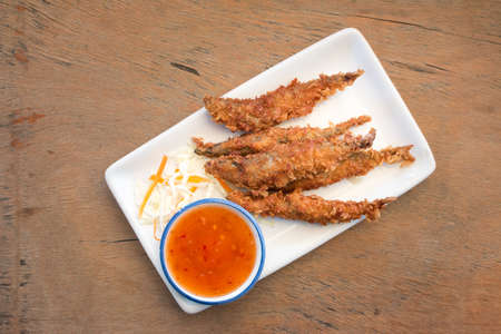 Deep Fried Egg Fish with sauceの写真素材