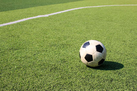 Football on artificial turf. It is for green background in a stadiumの写真素材